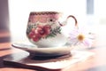 Cup with flower and sauser